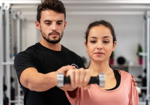 close-up-woman-exercising-with-dumbbell_23-2149178069.jpg Close up woman exercising with dumbbell
